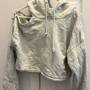 Mint green Cropped Hoodie. Open shoulder on right sid. Size small